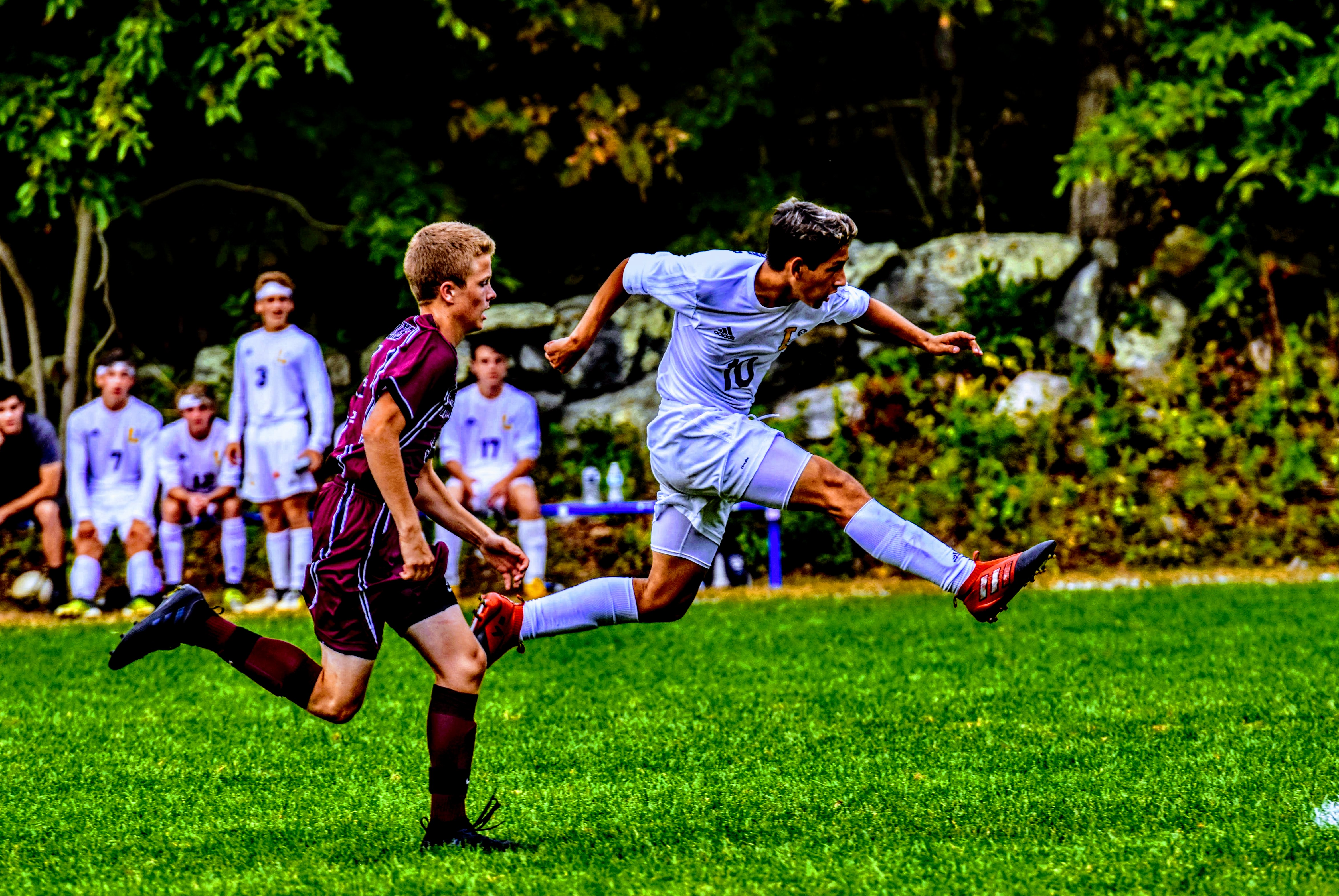 soccer player shooting ball